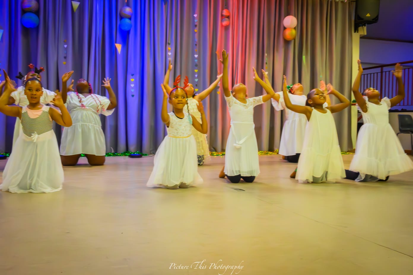 Girls performing a dance on stage